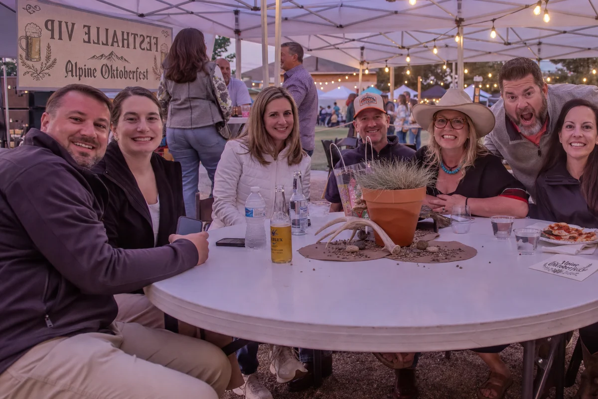 Guests in the shaded VIP lounge